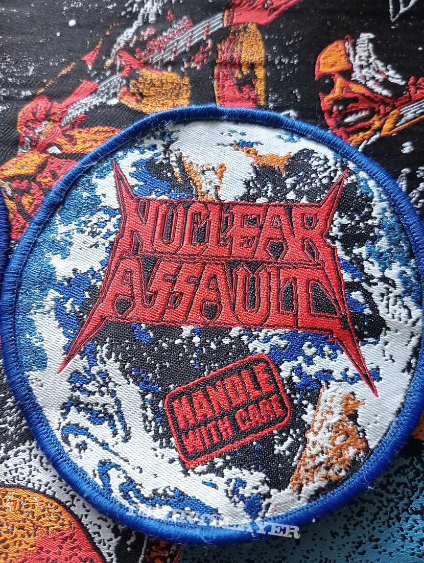Nuclear Assault - Handle With Care woven patch comparision