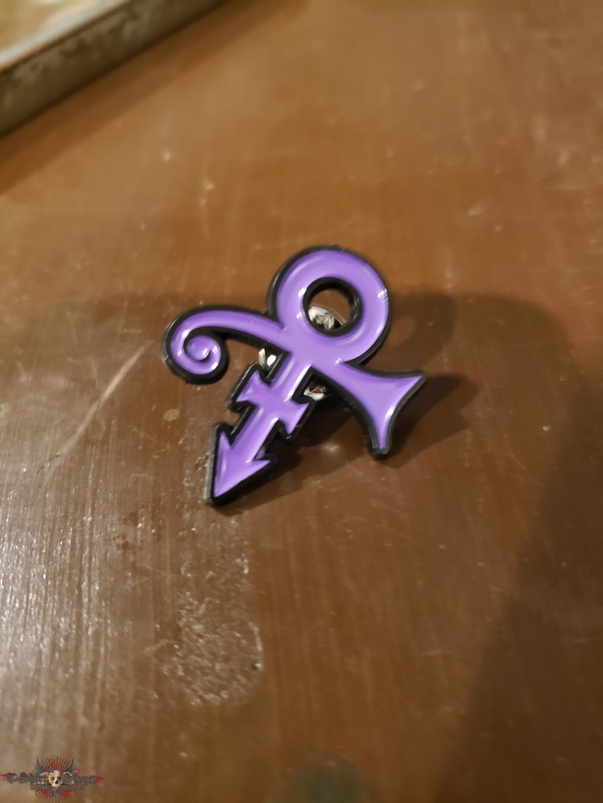 Prince enamel pin.