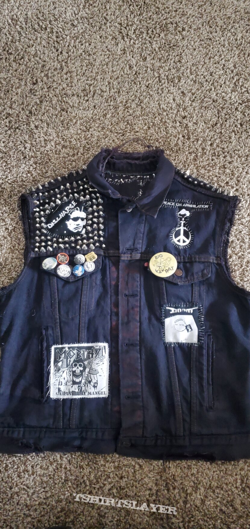 Discharge 10 yr old battle jacket I'm reworking. Got all of my favorite crusty bands. Finished the back now need a few more patches on the front and stud it. Discharge 10 yr old battle jacket I'm reworking. Got all of my favorite crusty bands. Finished the back now need a few more patches on the front and stud it.