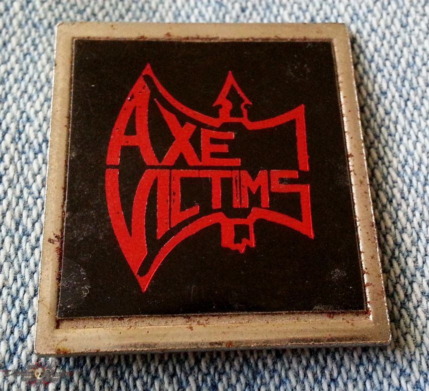 Axe Victims metal badge
